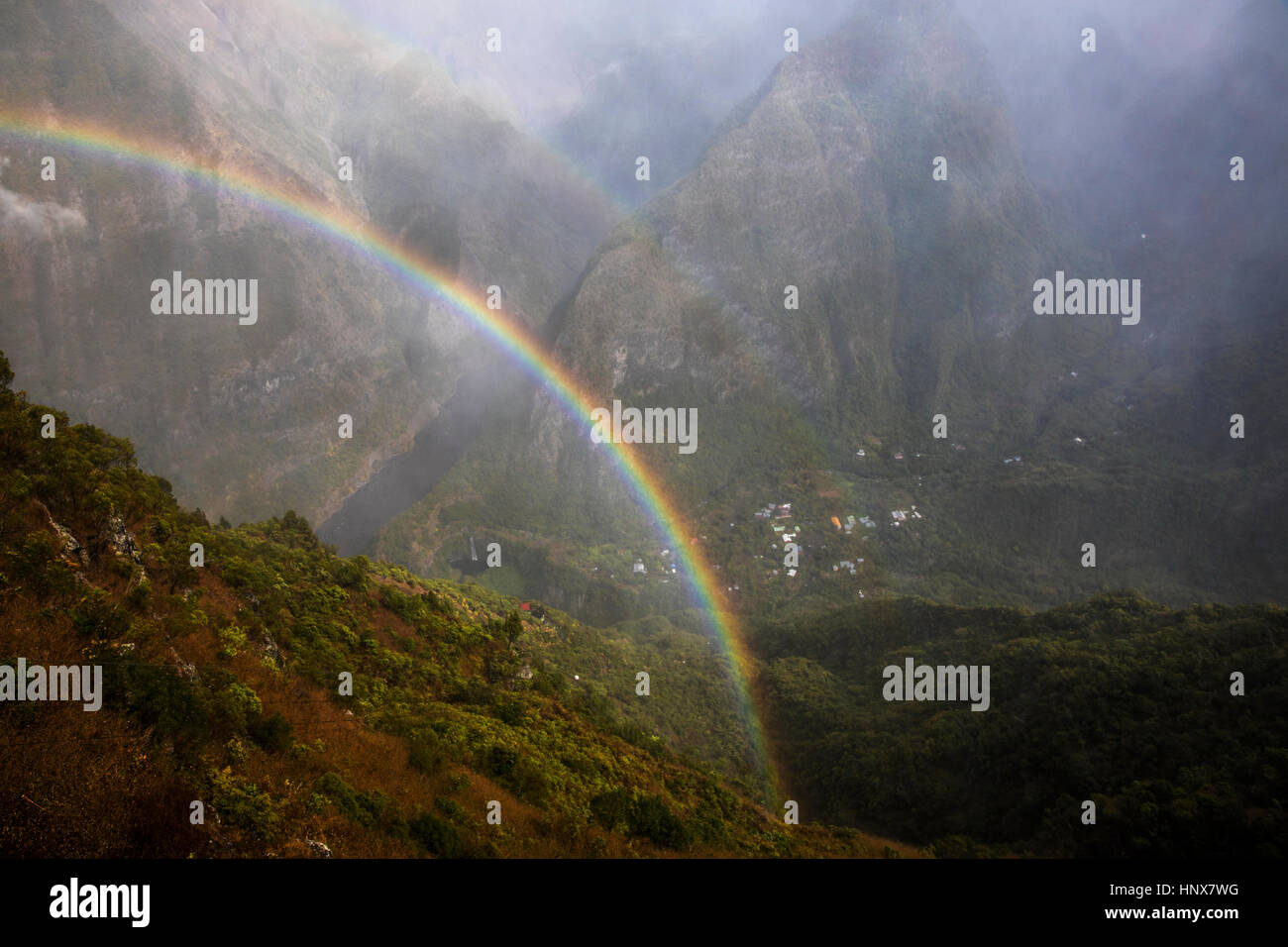 Mountain landscape with mist rainbow, Reunion Island Stock Photo