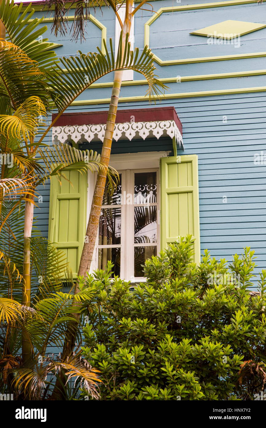 Traditional wooden grey house exterior with shutters, Reunion Island Stock Photo