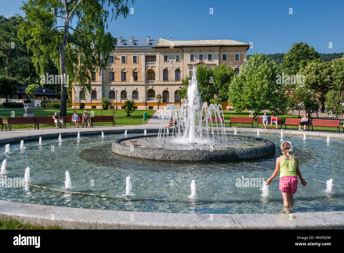 Child at fountain, Stary Dom Zdrojowy spa house in Krynica Zdroj spa resort, Beskid Sadecki region, Western Carpathians, Malopolska, Poland Stock Photo