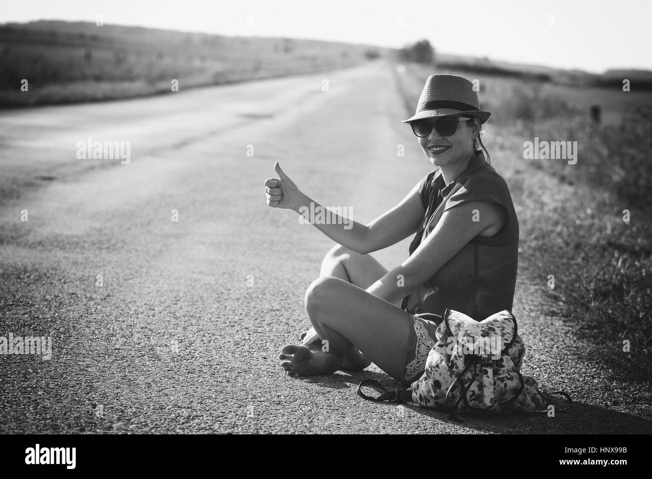 Traveler woman on the road Stock Photo