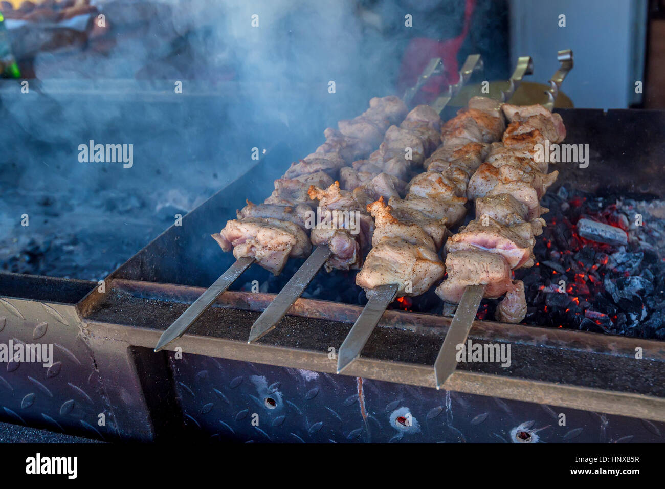Preparing shashlik on mangal Stock Photo