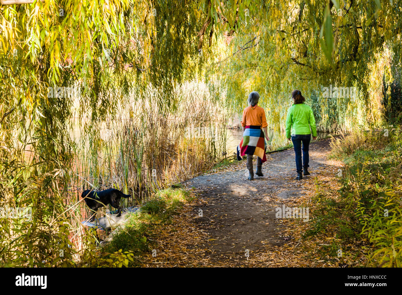 Two women walking on a pathway in High Park, Toronto. Stock Photo