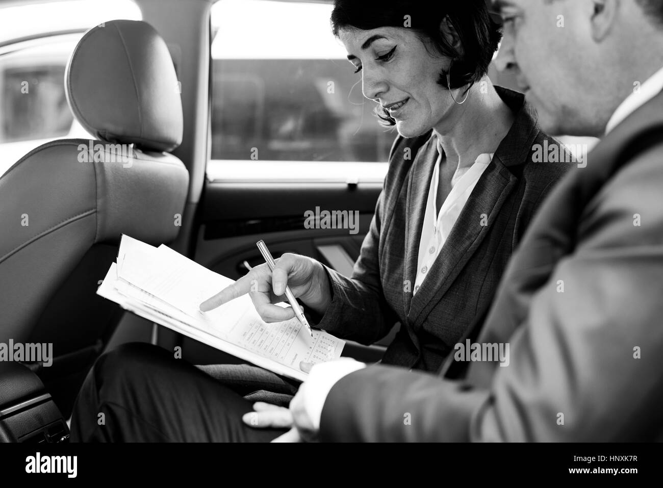 Business People Meeting Working Car Inside Stock Photo