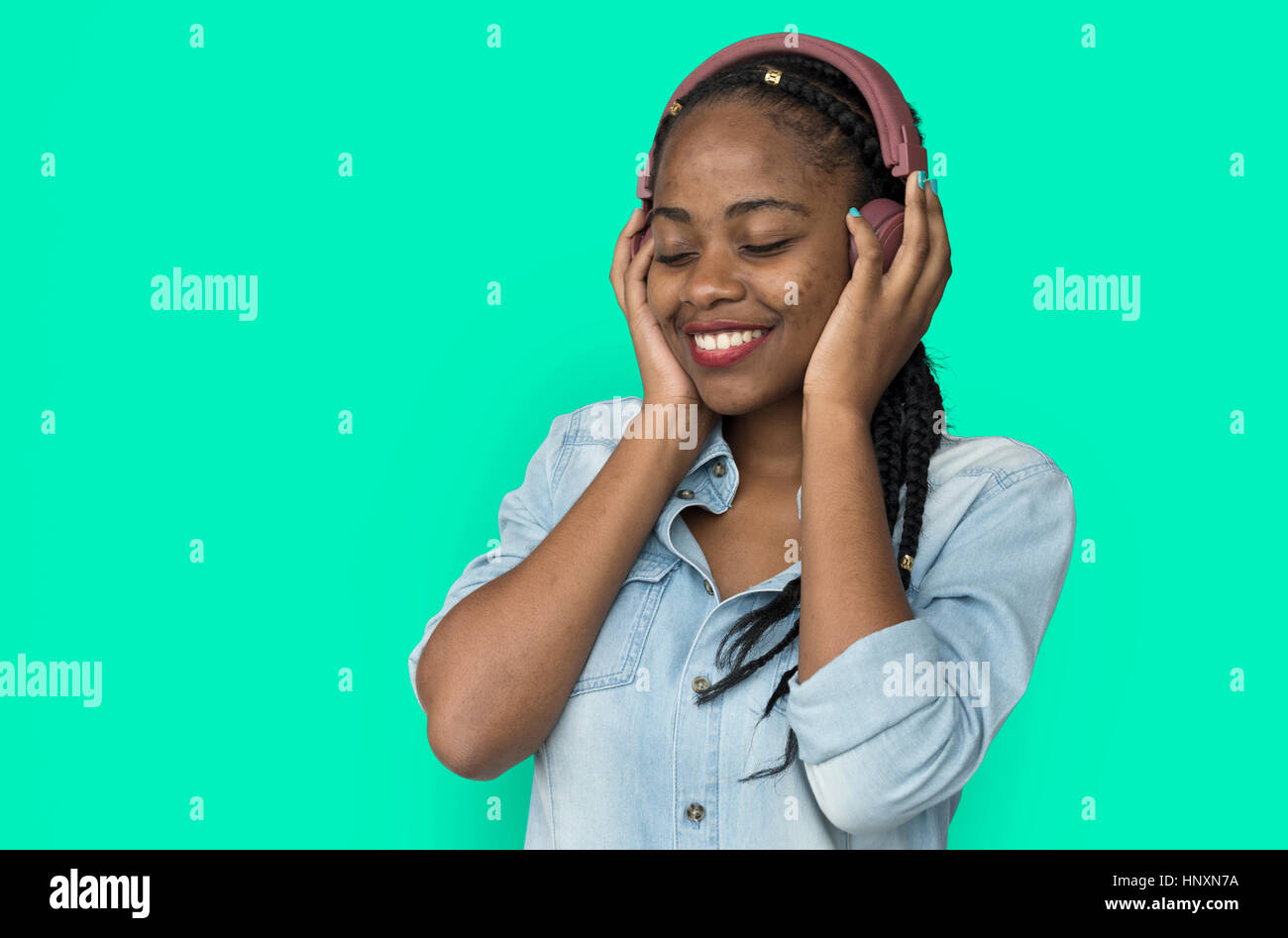 Young black girl listening to music headphones Stock Photo - Alamy