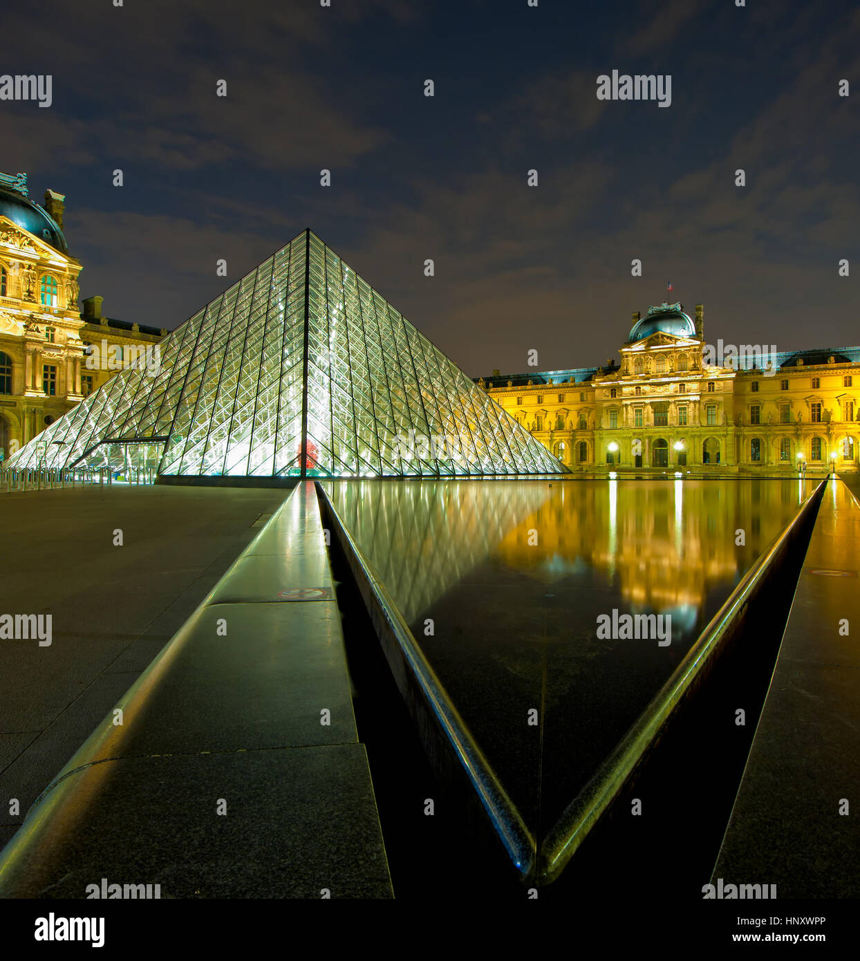 Louvre museum at night, Paris, France Stock Photo