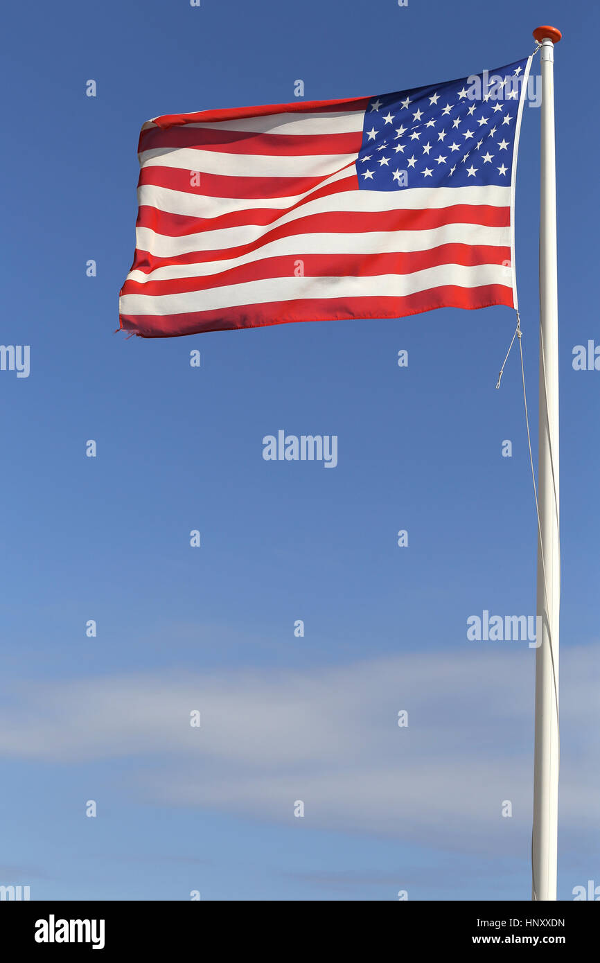 US flag flying in the wind Stock Photo