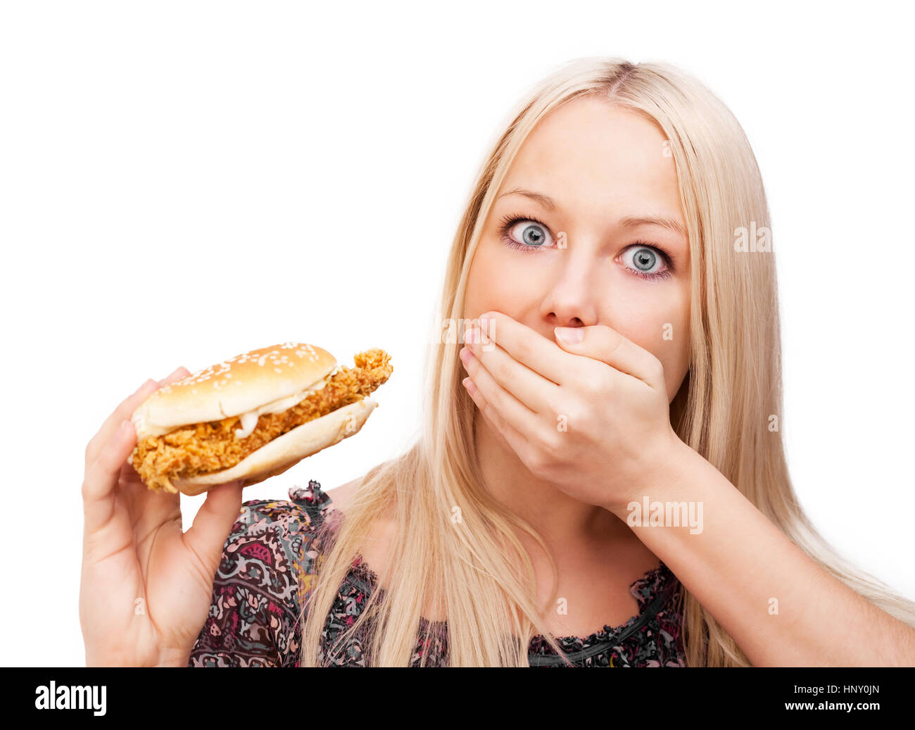 beautiful woman scared of eating burger and gaining weight, isolated