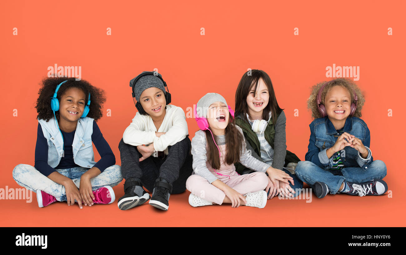 Group of Children Studio Smiling Wearing Headphones and Winter Clothes ...