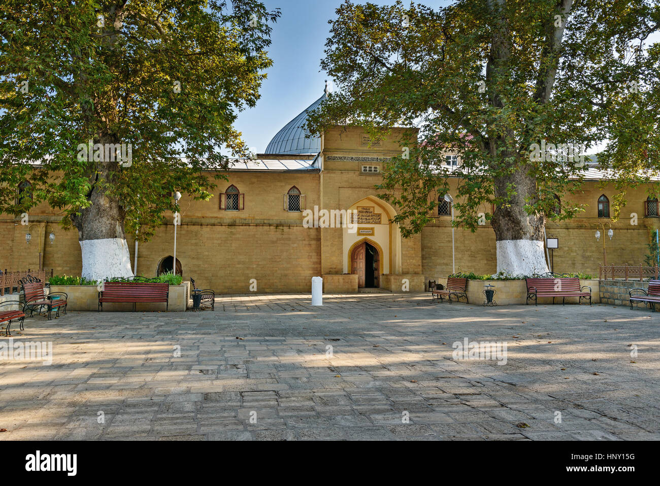 Juma Mosque - the most ancient mosque in Russia. Old trees Platanus orientalis in the yard. Derbent. Republic of Dagestan, Russia Stock Photo