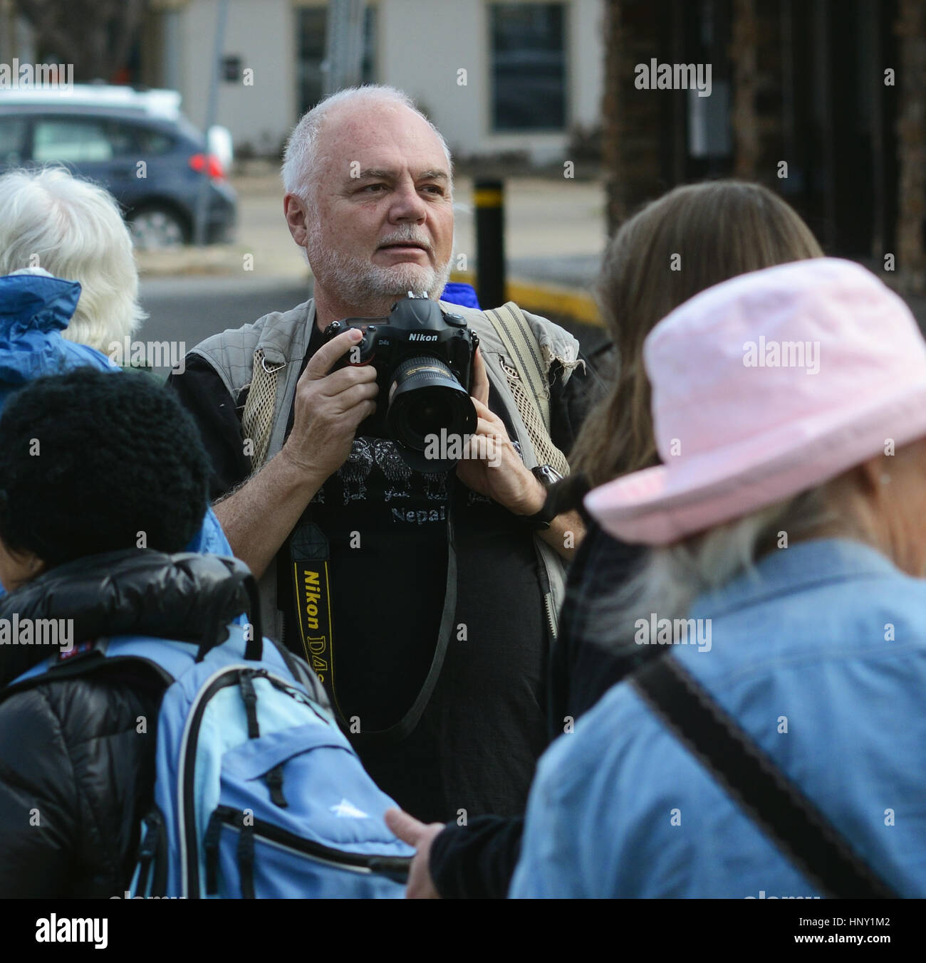 Photographer searches for photo opportunities during Boulder, Colorado, political rally protesting Trump administration policies Stock Photo