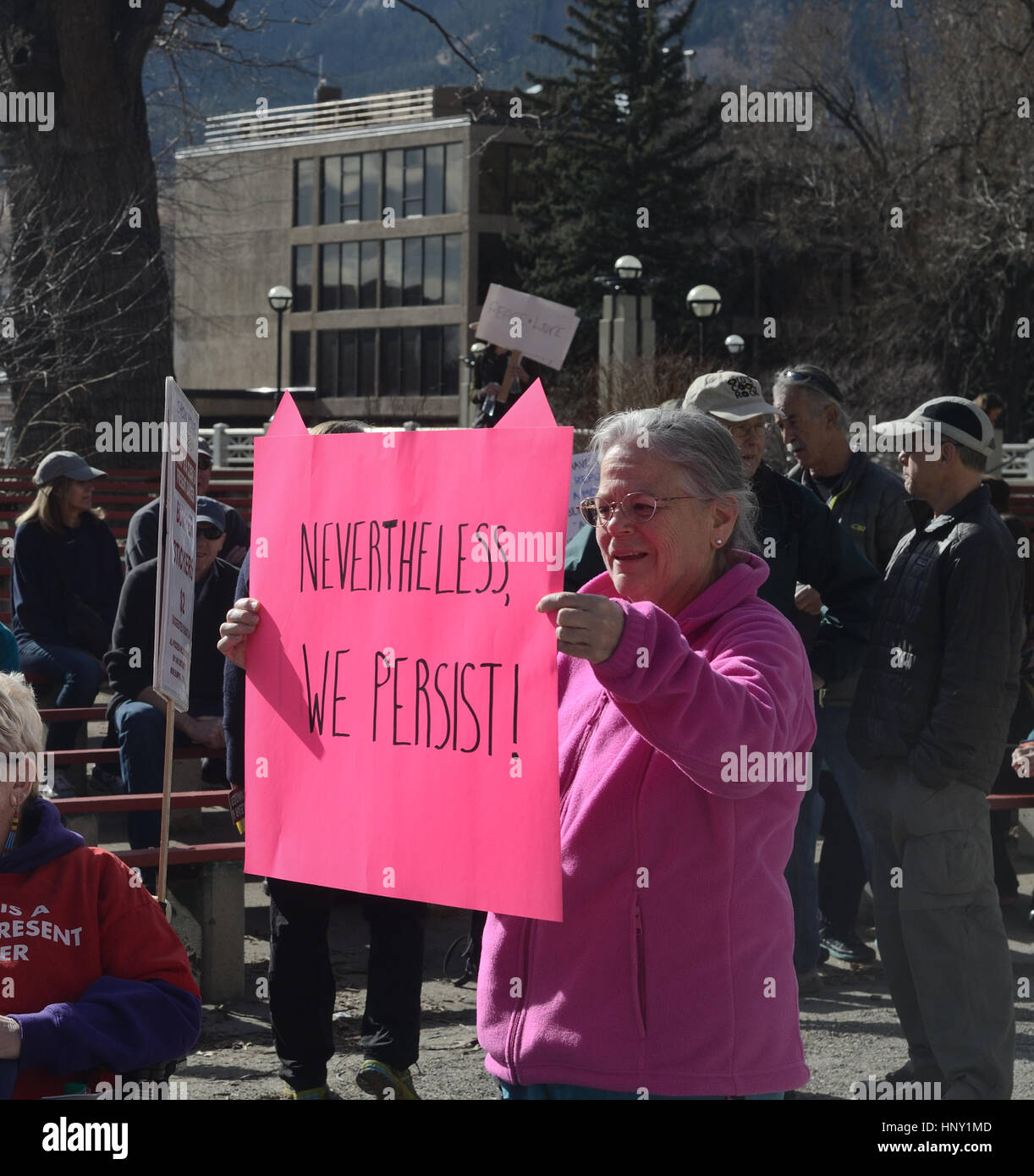 Protester holds 'Nevertheless we persist' sign in Boulder, Colorado Stock Photo