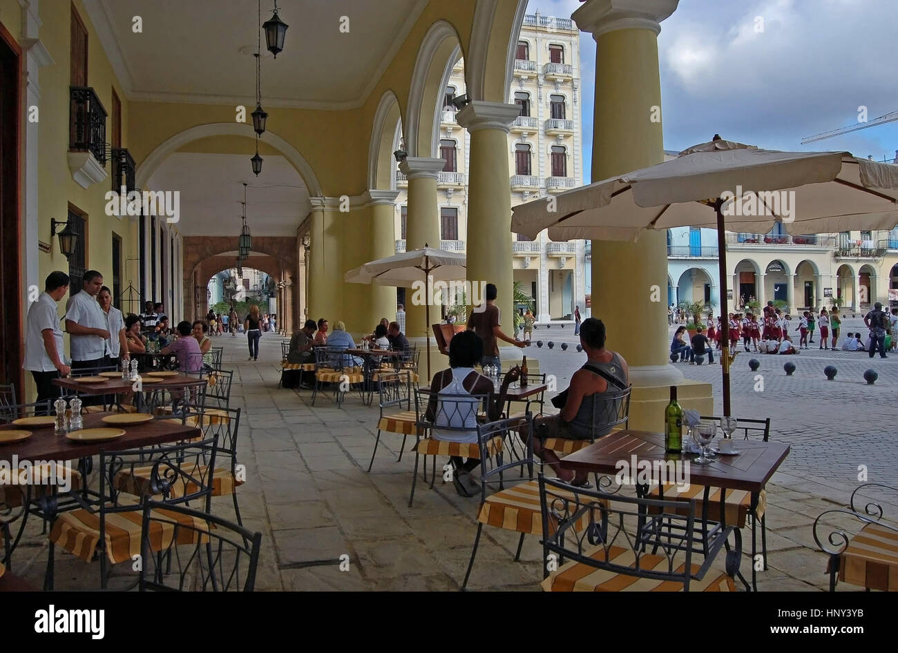 The outdoor restaurant in the portico of the Benitez de Parejo Building,  Plaza Vieja, Havana, Cuba Stock Photo