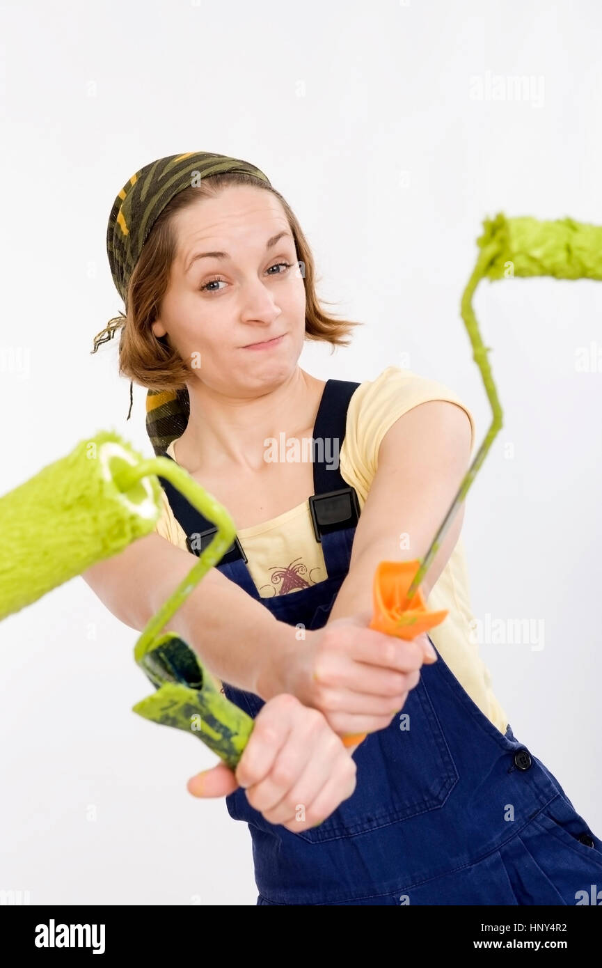 Model release, Junge Frau mit Farbroller, Heimwerkerin - young woman with paint roller Stock Photo
