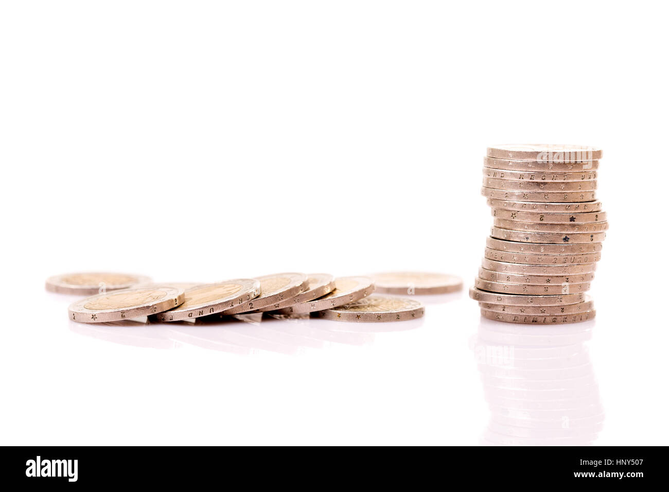 Heap of two euro coins isolated on white background Stock Photo - Alamy