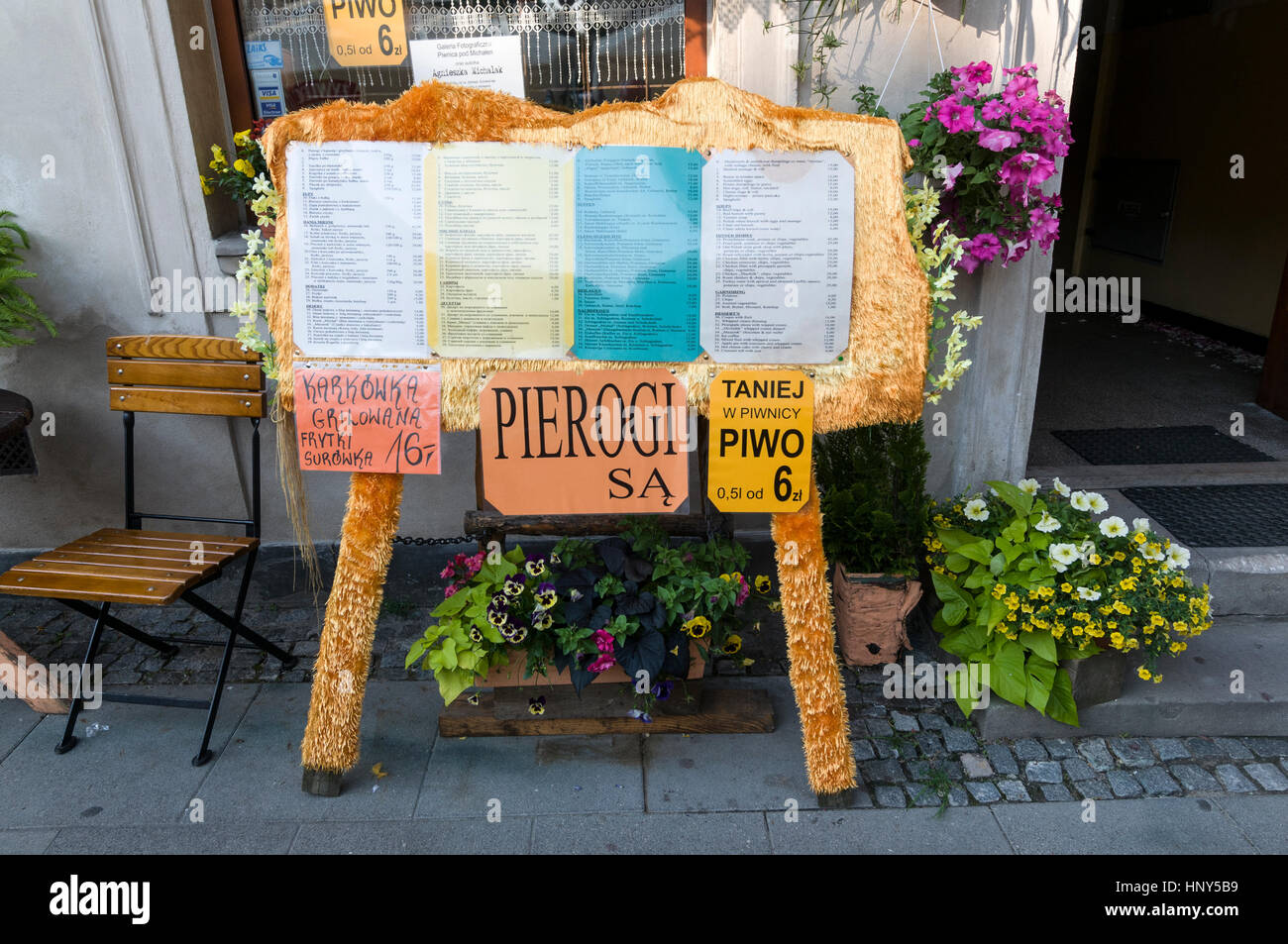 A flower decorated Polish menu board at a restaurant in Warsaw Old Town, Warsaw, Poland Stock Photo