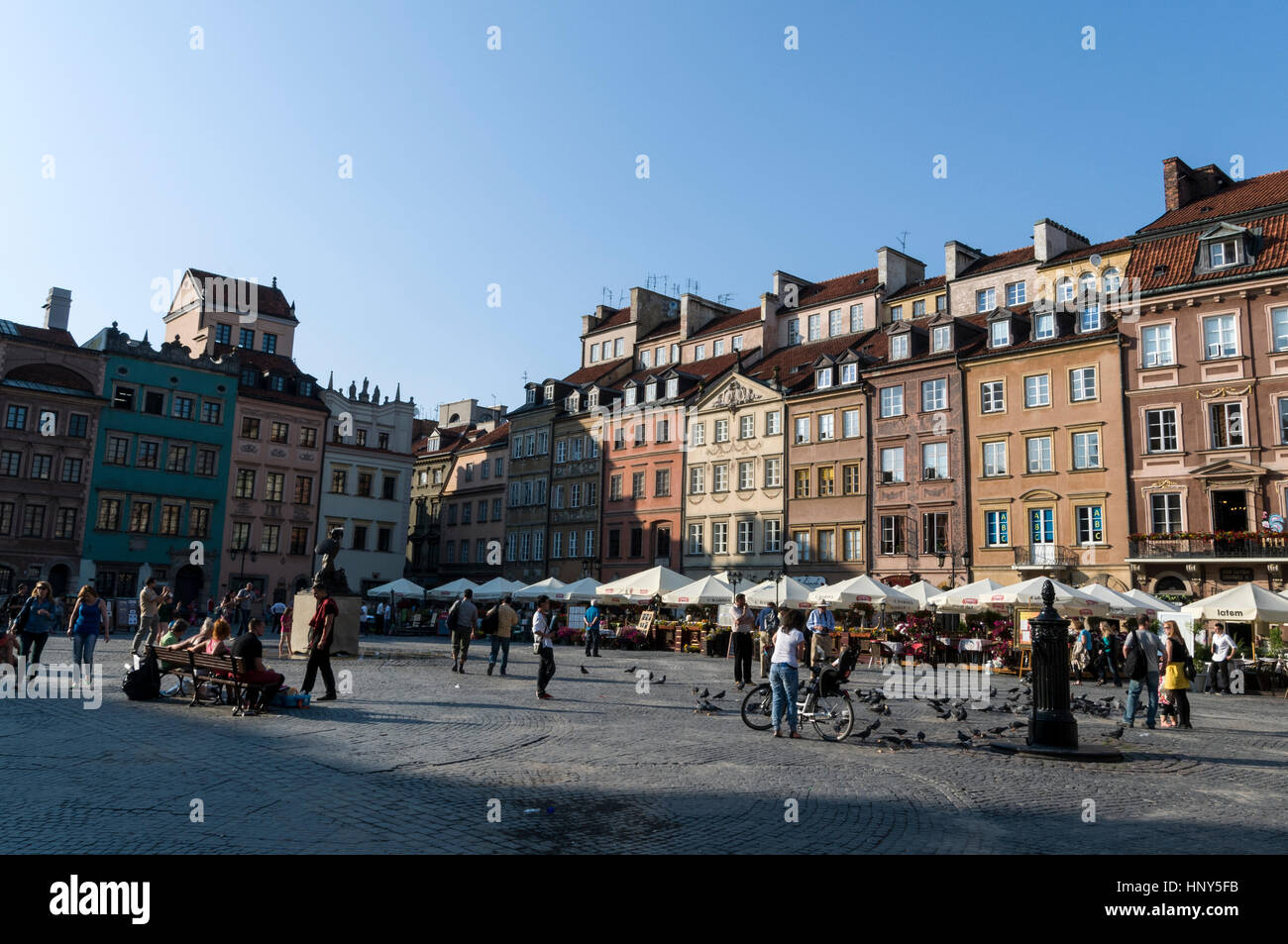 Warsaw's Old Town Market Place is a main square surrounded with restaurants, cafes and souvenir shops. The buildings are of a mix of Gothic,Renaissanc Stock Photo