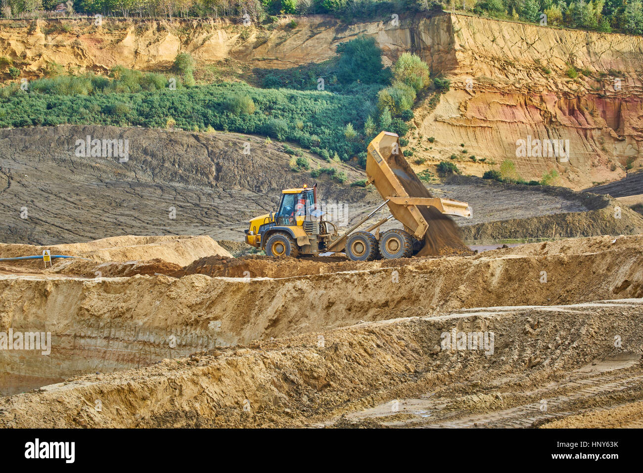 Quarrying sand with a tipper in a quarry Stock Photo