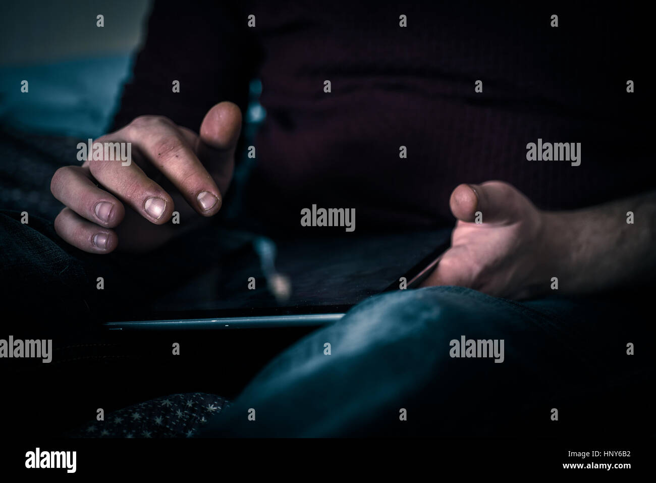 Old man uding his tablet with a fictional onbox folder email screen Stock Photo