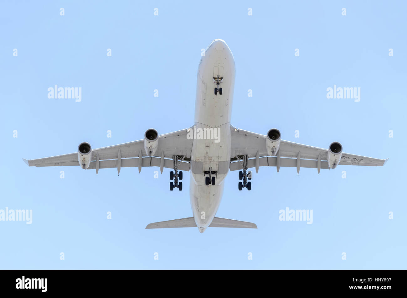 Plane Airbus A340, of Iberia airline, is landing. Spanish company. Blue