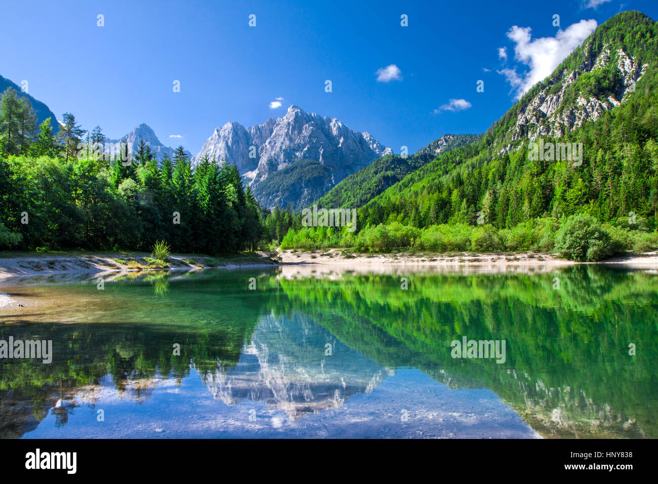 Julian Alps reflected in the lake surface in Triglav National Park, Slovenia Stock Photo