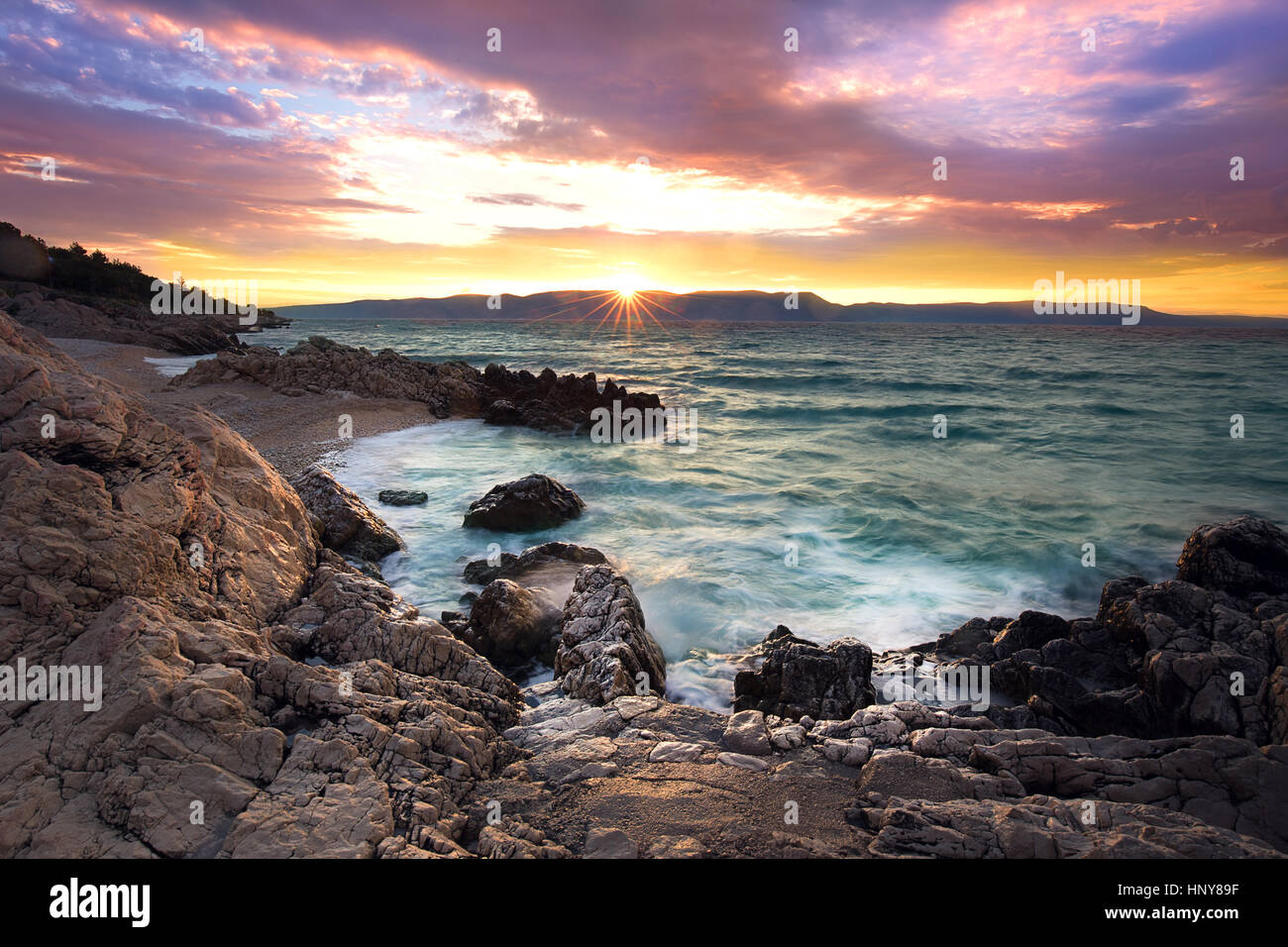 Sunrise on rocky beach, Istria, Croatia Stock Photo