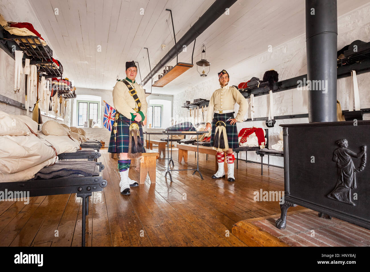 Reenactor soldiers of the 78th Highland Regiment stand in the sleeping quarters of the Halifax Citadel in Halifax, Nova Scotia, Canada. Stock Photo