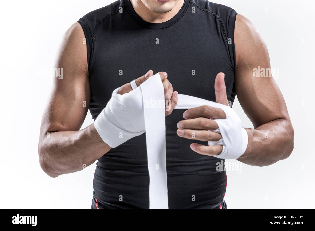 Boxer putting bandage on his hands Stock Photo Alamy