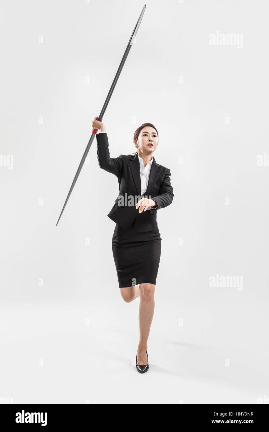 Businesswoman with javelin Stock Photo