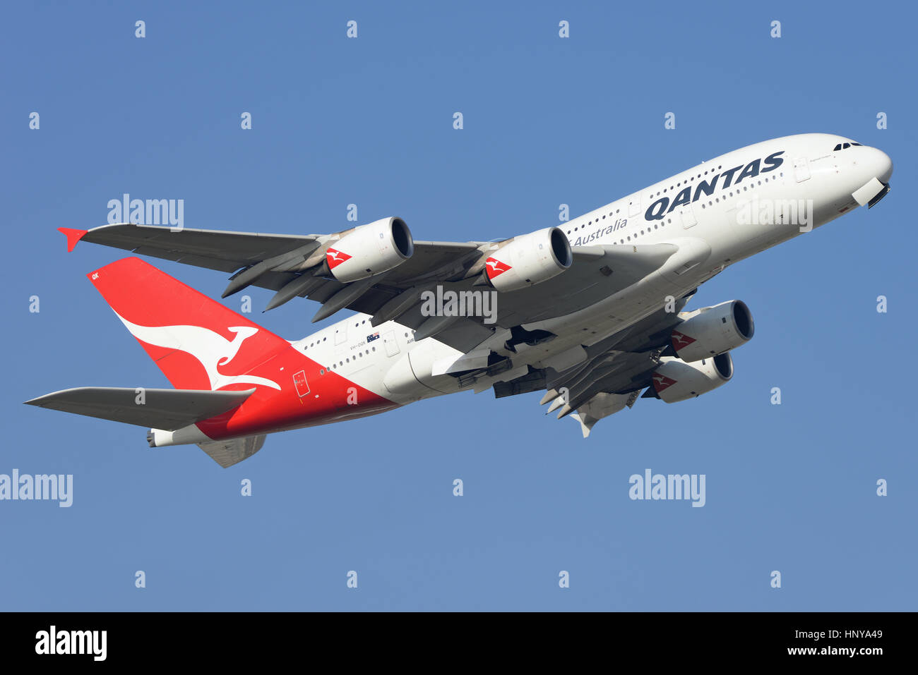 Qantas Airbus A380 -842 jet airliner plane VH-OQK taking off from London Heathrow Airport in blue sky. Space for copy Stock Photo