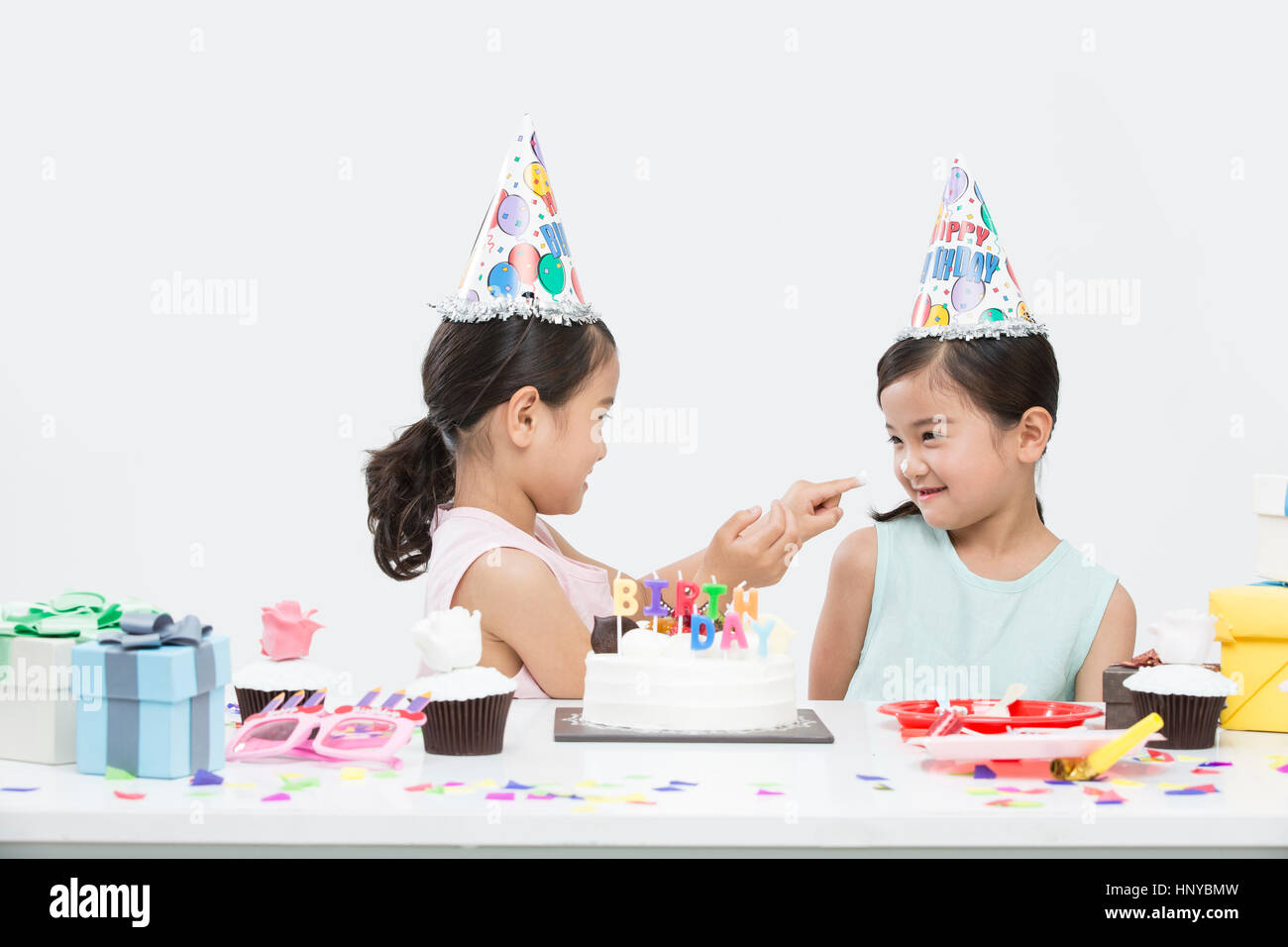 Smi2 twin girls at birthday party Stock Photo