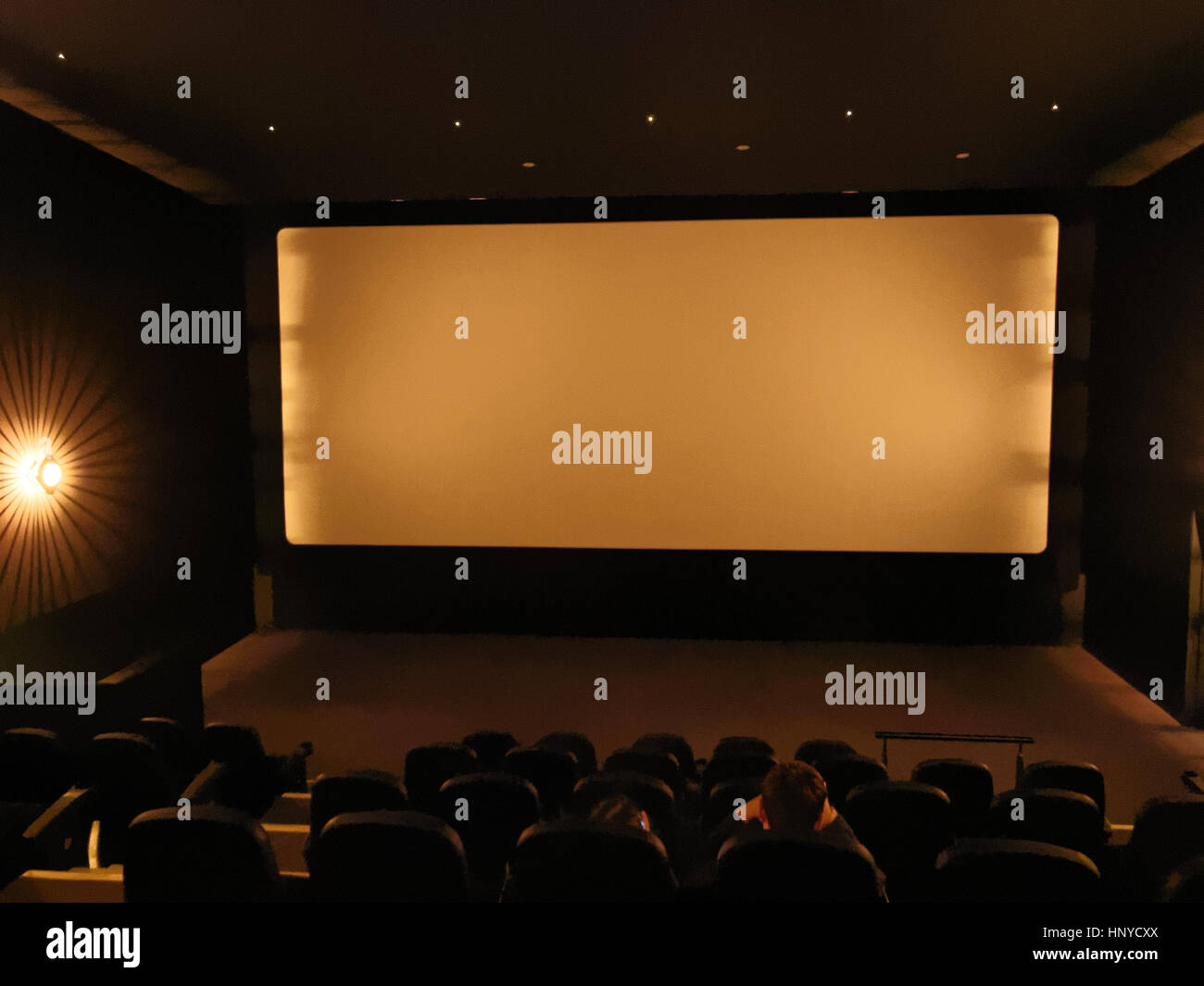 interior of cinema theater with screen and lights out Stock Photo