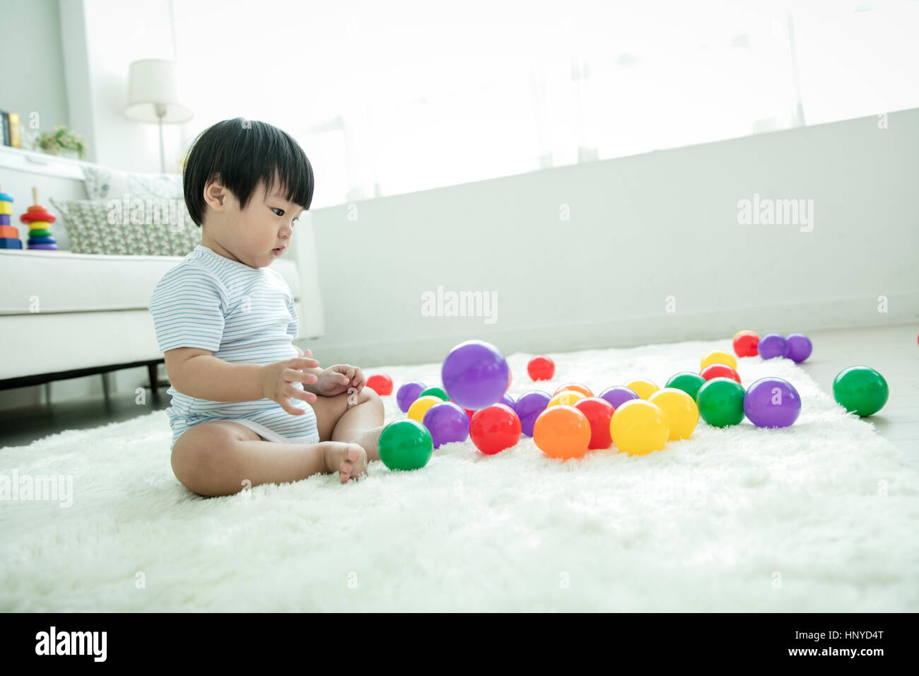 Baby boy with balls asian hires stock photography and images Alamy
