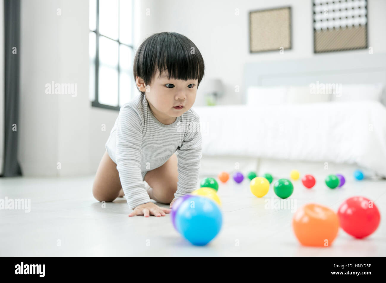 Baby boy with balls Stock Photo Alamy