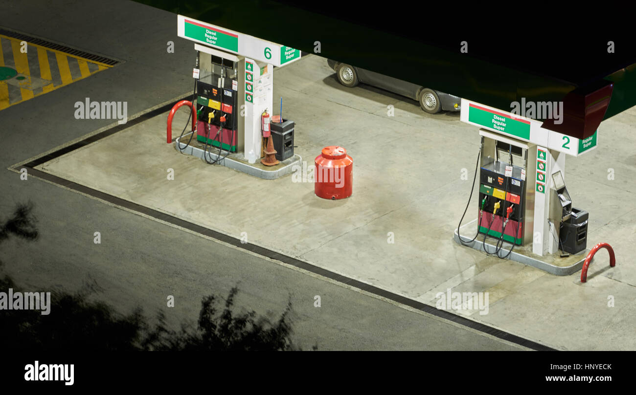 Gas station pump at night light tme Stock Photo