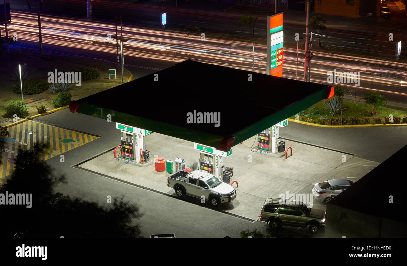 Gas station at night city with blurred car lights Stock Photo