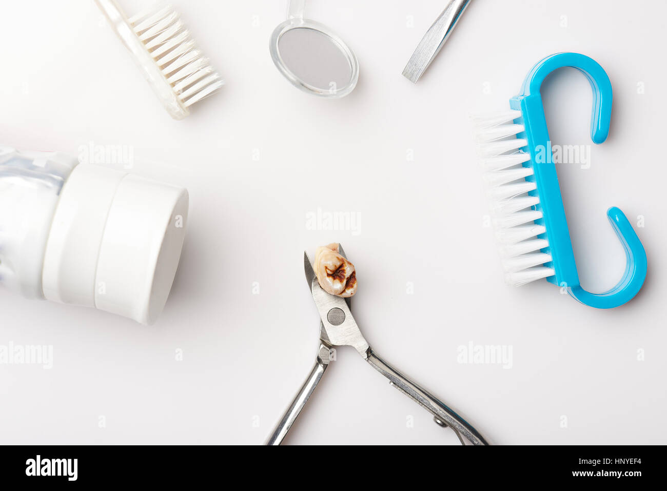 Dental tools with teeth damaged of cavity isolated on white background Stock Photo