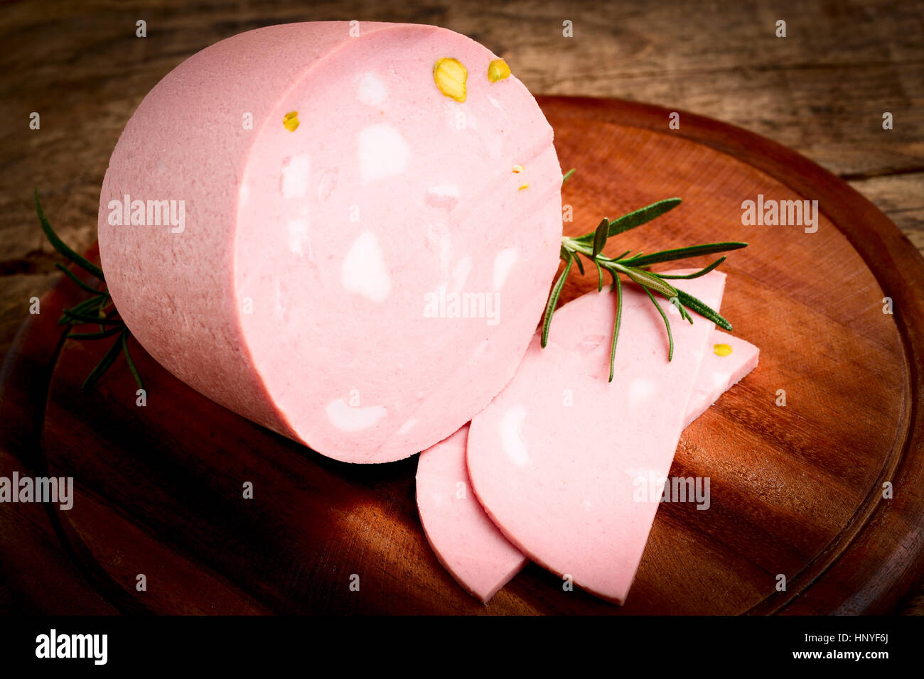 italian mortadella salami on wood Stock Photo Alamy