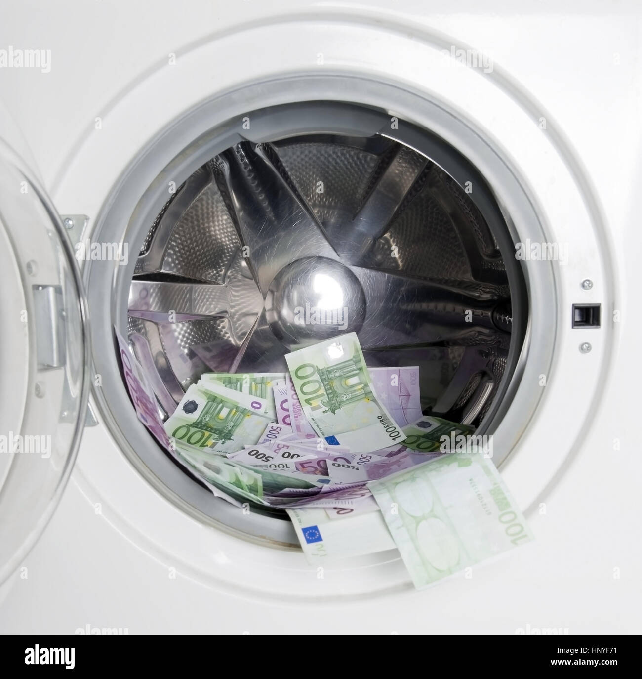 Symbolbild Geldwaesche, Eurogeldscheine in der Waschmaschine - symbolic for money laundering Stock Photo