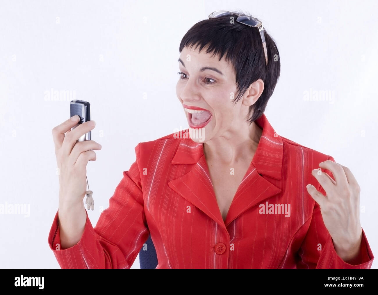 Model release , Schreiende Geschaeftsfrau mit Handy - screaming business woman with mobile phone Stock Photo