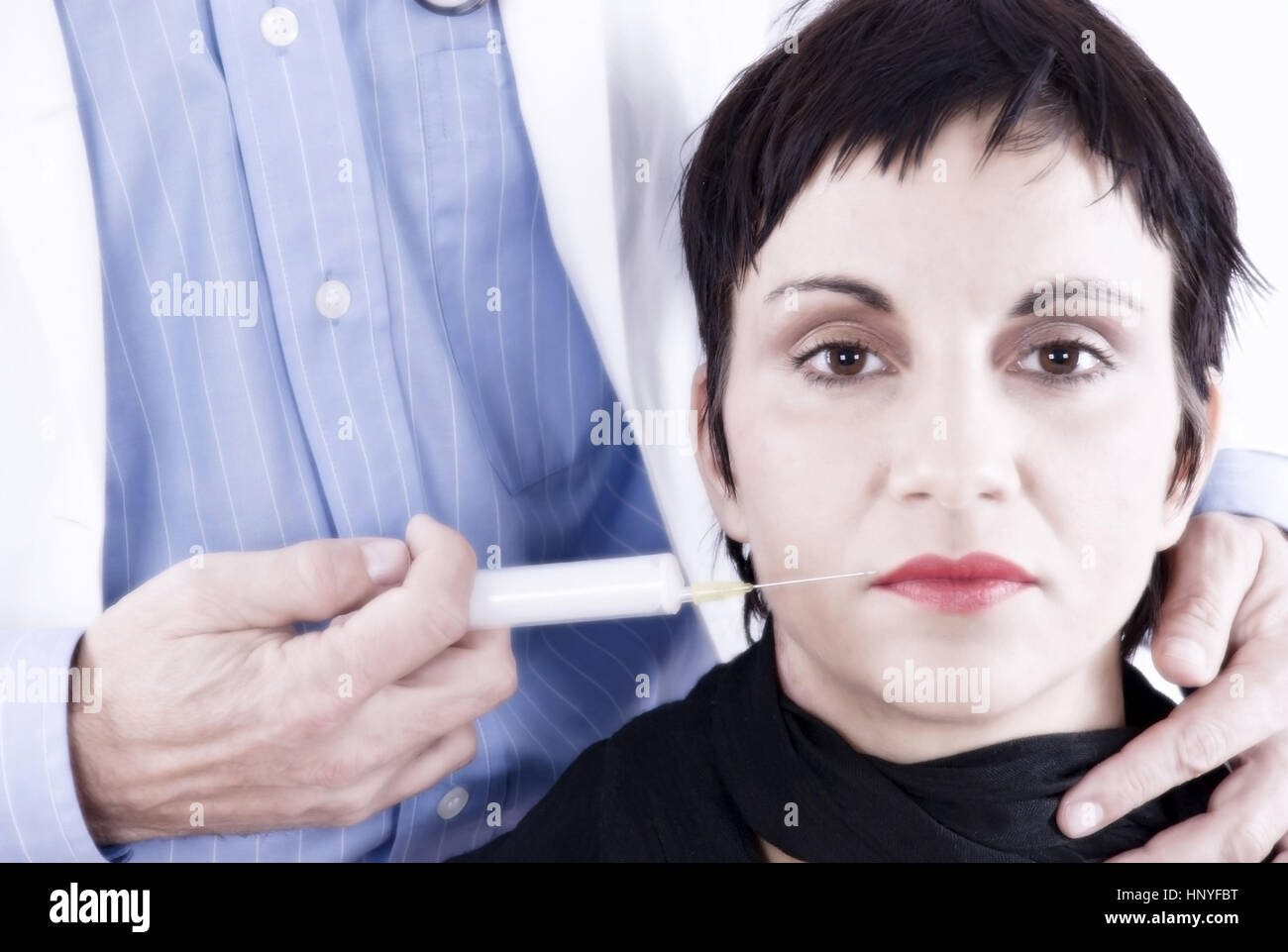 Model release , Symbolbild Faltenspritze - symbolic for botulin toxin Stock Photo