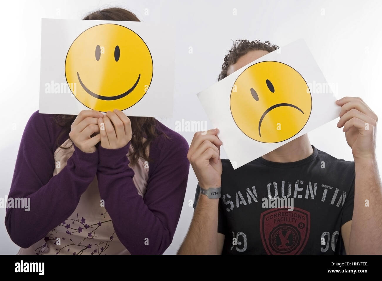 Model release , Frau und Mann mit lachendem und traurigem Smiley - man and woman with laughing an sadly smiley Stock Photo