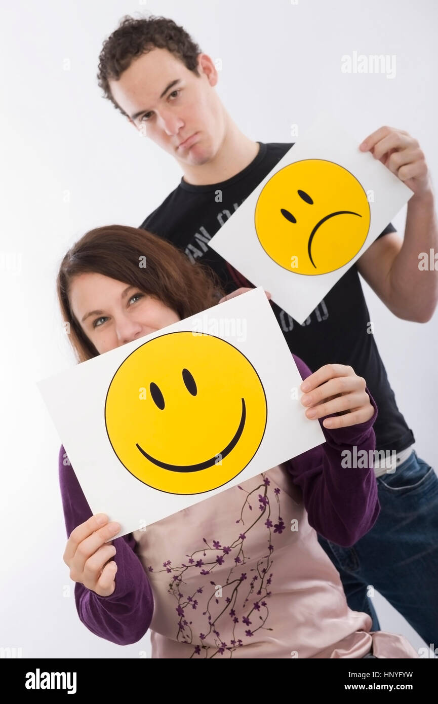 Model release , Maedchen und Junge mit lachendem und traurigem Smiley - girl and boy with laughing an sadly smiley Stock Photo