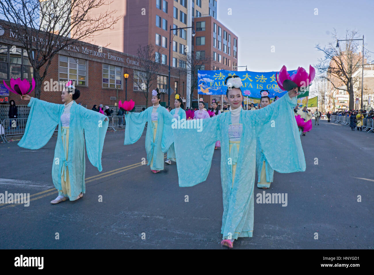 Marchers in the annual Chinese New years Day Parade on Chinatown, Flushing, Queens, New York City Stock Photo