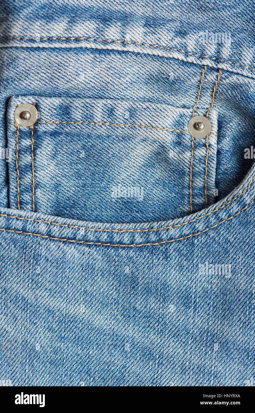 Mini pocket in blue jeans close up and stiches Stock Photo