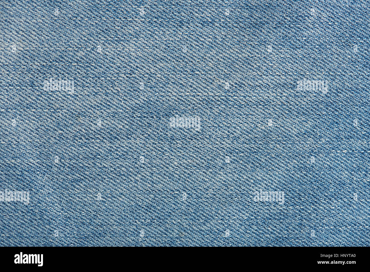 Horizontal texture of light blue jeans close up Stock Photo