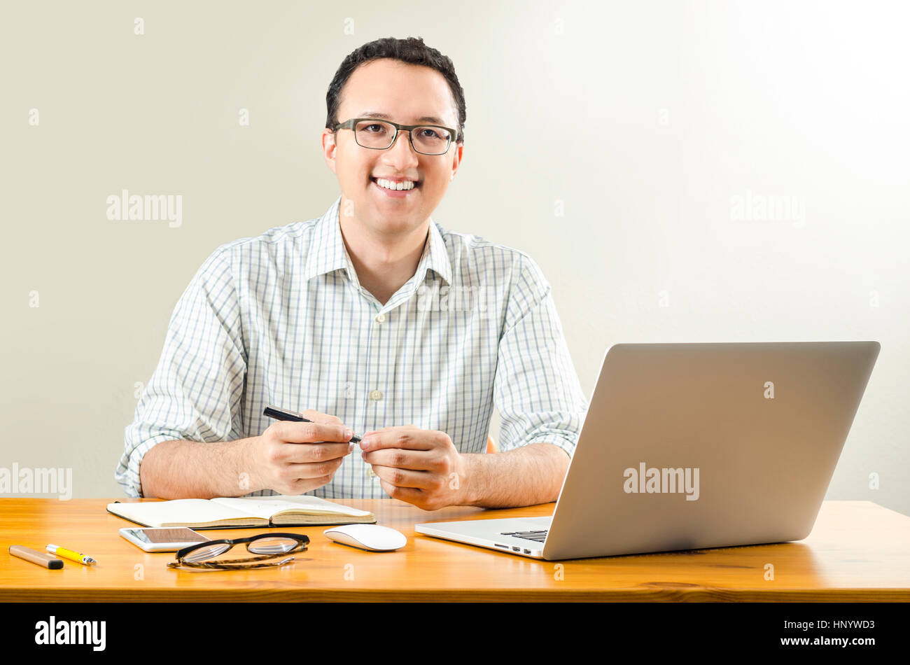 Young Professional Working at Desk from Home Stock Photo