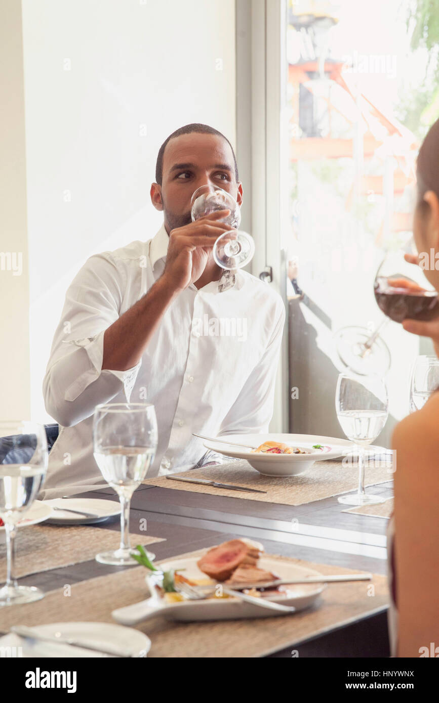 Man drinking wine in restaurant Stock Photo - Alamy