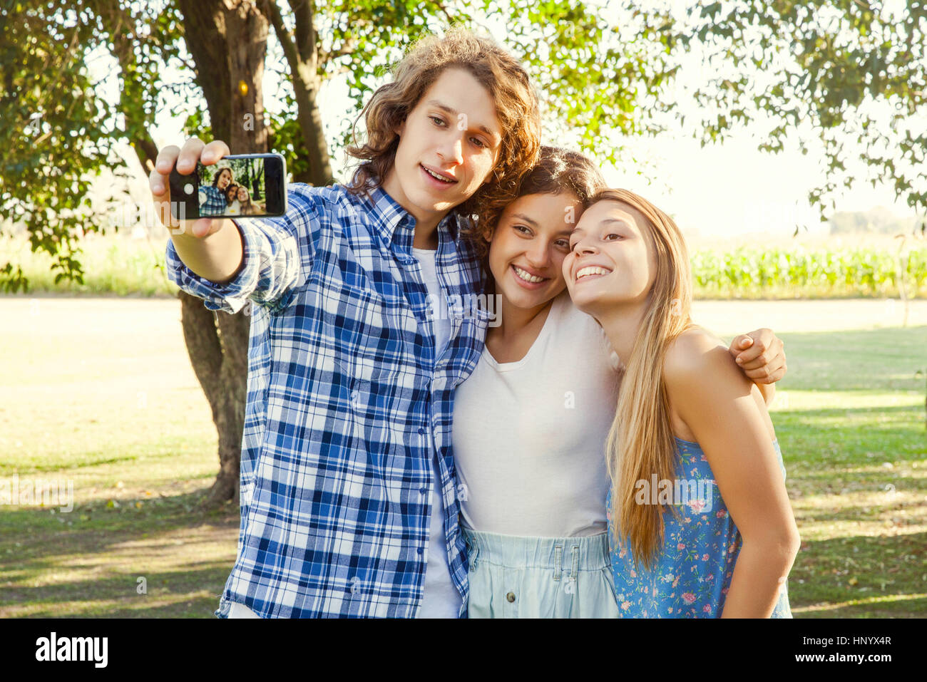Friends posing together for selfie Stock Photo - Alamy