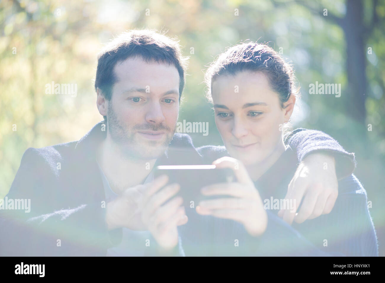 Man getting camera ready for selfie with girlfriend Stock Photo