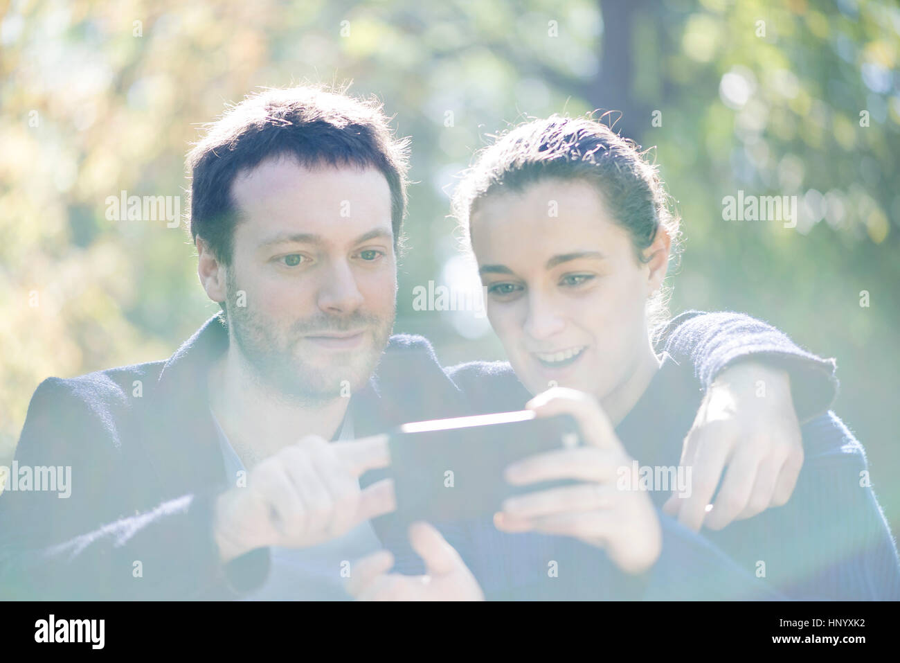 Man getting camera ready for selfie with girlfriend Stock Photo